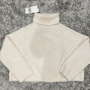 cropped light pink turtleneck sweater
